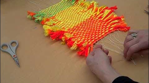 Taking a weaving off a loom