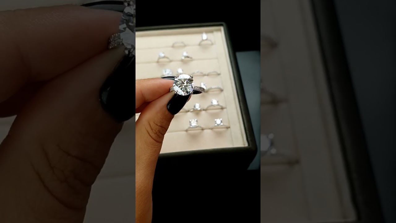 2-carat round diamond ring, accented with radiant side stones