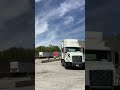 Tractor trailer spins around back in dock (front view)