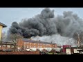 Firefighters tackle factory blaze as thick smoke makes it 'hard to breathe'