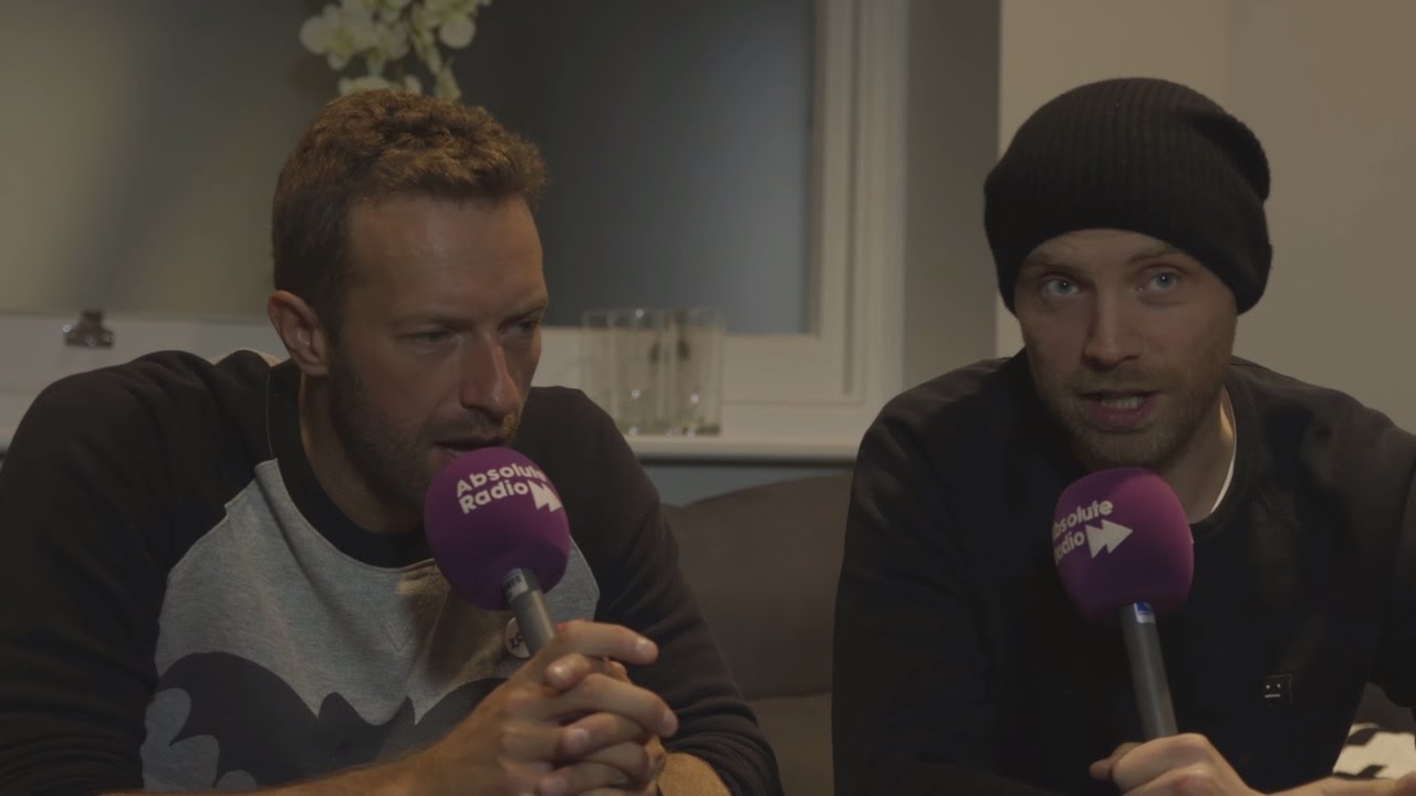 Coldplaying on X: Jonny Buckland and Will Champion with a fan at