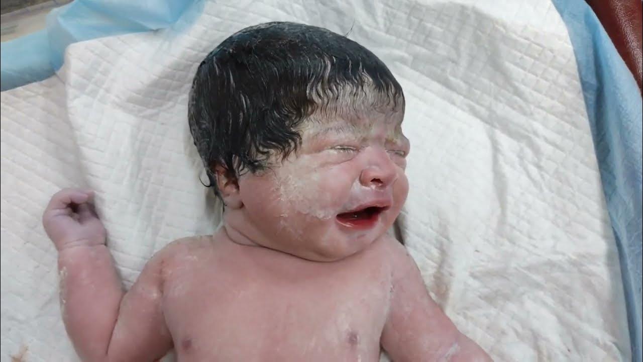 Thick Hair of Beautiful newborn baby Girl after birth with Full body