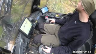 Drive a tree harvester (forest machine) inside cabin