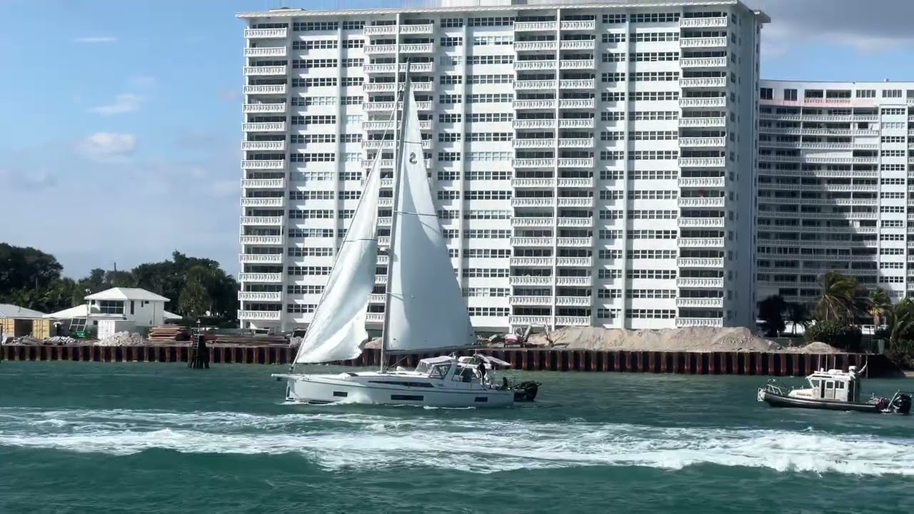 Under sails (no engines) into Port Everglades inlet between cruise ships.