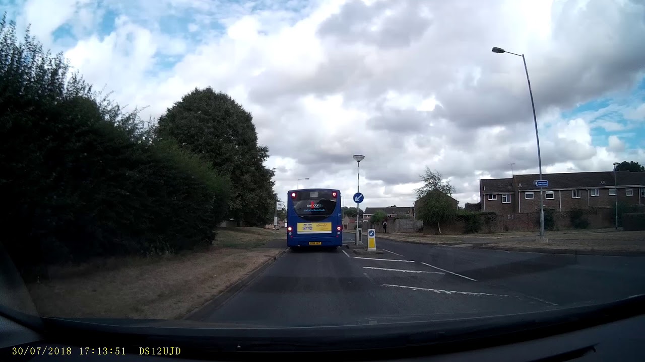 Van Overtakes Swindon Bus on a Keep Left Bollard on Liden Drive Swindon