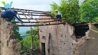 The boy cleans and renovates the old abandoned house in the hills