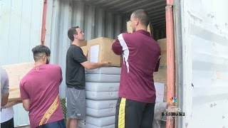 VCOM students pack medical supplies