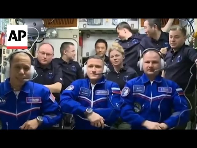 US-Russian crew aboard Soyuz spacecraft dock at International Space Station