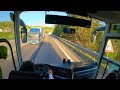 Driving bus narrow road with trucks, Italy