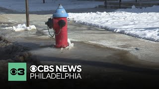 Roads and sidewalks covered in ice after water main breaks in Trenton, New Jersey