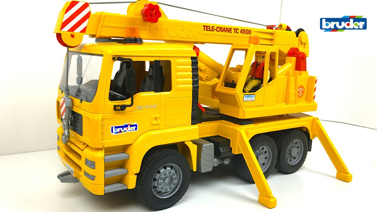 CAMION GRUA BRUDER MAQUINAS DE CONSTRUCCION - MAN TGA MEZCLADORA Y CAMION DE VOLTEO CAT