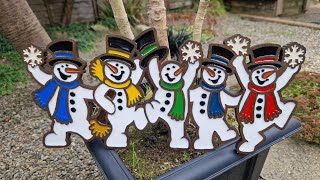 Jolly Snowmen Decoration cut out on plywood and inlayed with resin. Scroll saw project..