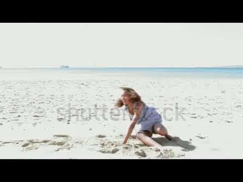 Little girl cartwheel in dress.