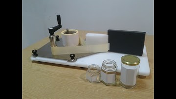 Manual labeling machine for jars