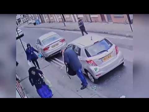 Shocking moment gang of men use brazen tactics to rob elderly woman in broad daylight