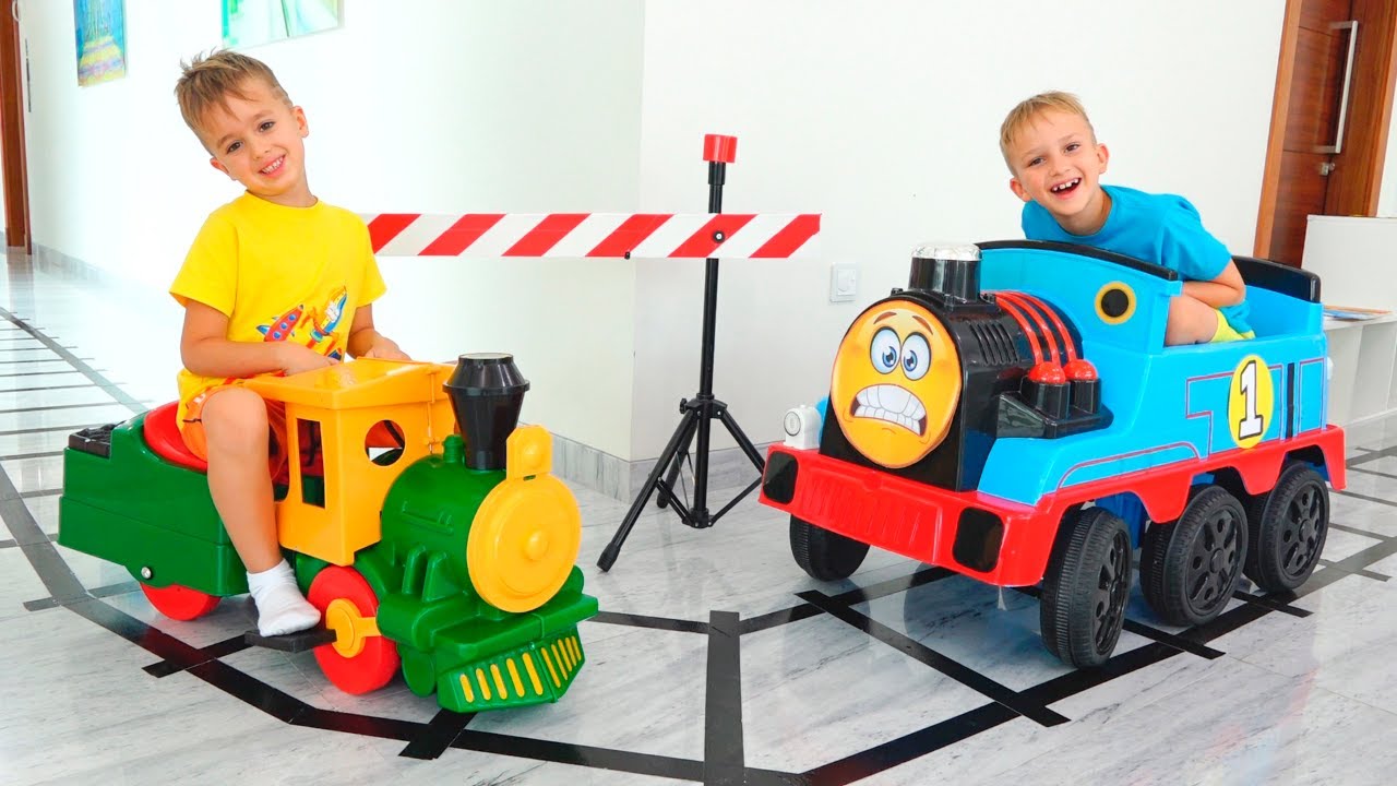 ⁣Vlad e Niki brincam com trens de brinquedo