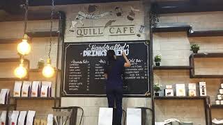 Chalkboard and mural artwork at Quill Cafe Dubai screenshot 5