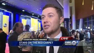 Rachel Santschi talks with Scotty McCreery at CMAs