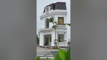 Tranh đắp xi măng giả đồng cho mặt tiền nhà góc