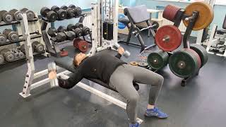 Breeding dumbbells lying on a bench