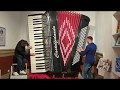 Playing on giant accordion