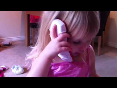 Funny cute Welsh girl only two years old on the ph...