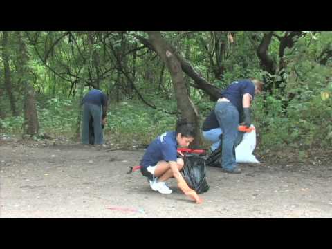 LCRA Community Services employees clean up trash under Montopolis Bridge transmission line speaker