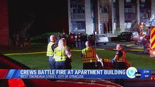 Crews battle fire at Syracuse apartment building
