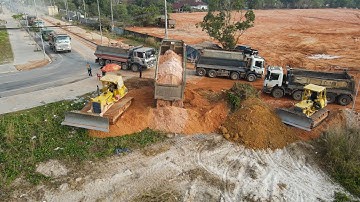 Nice Team Working Filling Up Land by Operator Skills Bulldozer Spreading Stone  and many  Dump Truck