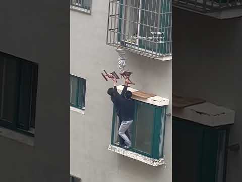 Neighbours rescue boy dangling from 4th-floor window in China #ytshorts