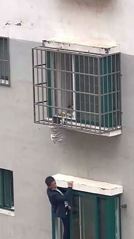 Neighbours rescue boy dangling from 4th-floor window in China #ytshorts