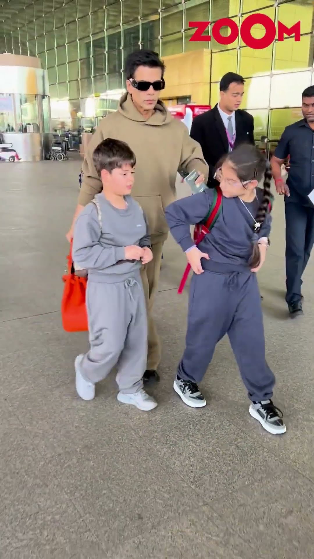 Karan Johar and his kids briefly POSE for the paps as spotted at the airport #karanjohar #shorts