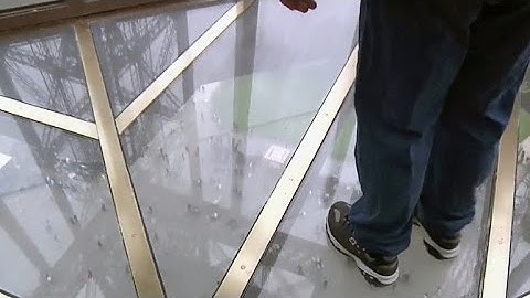 Eiffel Tower debuts glass floor for 125th birthday