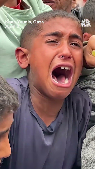 Hungry children struggle for food handouts in Gaza