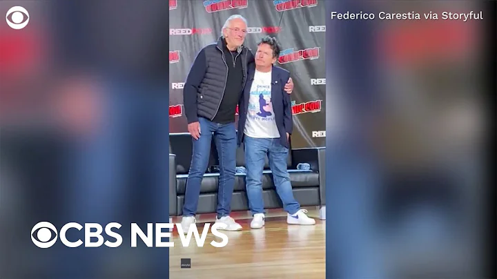 Michael J. Fox and Christopher Lloyd share hug ons...