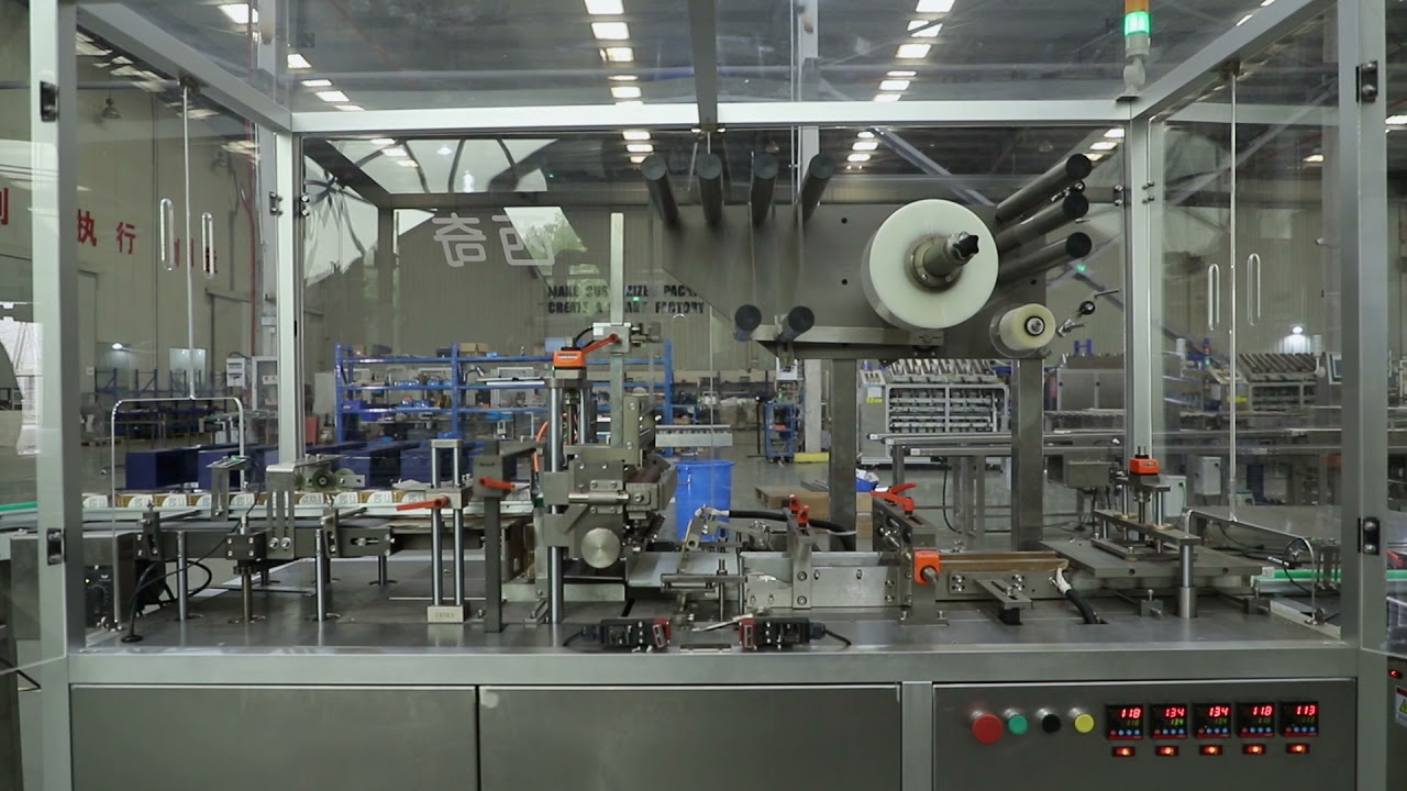 Automatic cellophane wrapping machine - YouTube