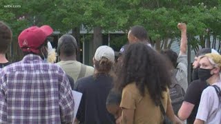 Protesters take knee with police at station, continue march at State House