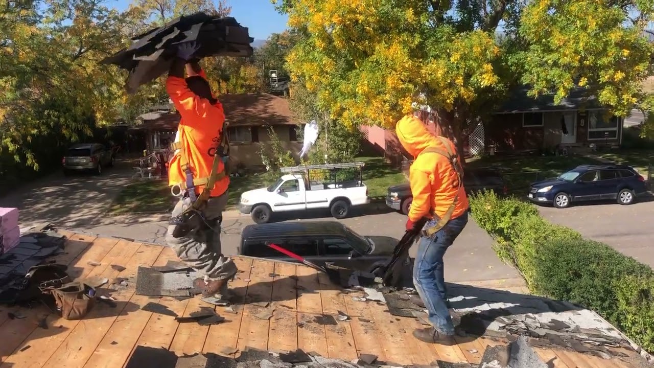 Denver Roof Replacement: Expert Shingle Removal by Cenco Roofing Crew