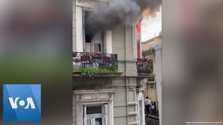 Woman Escapes Fire by Sliding Down a Cable in Buenos Aires| VOA News