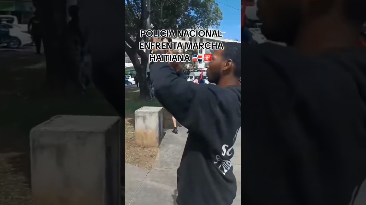Policía enfrenta la marcha haitiana. 