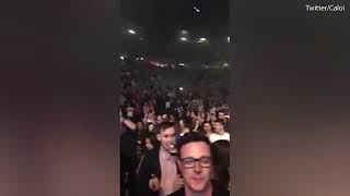Manchester crowd hold a minutes applause for bombing victims
