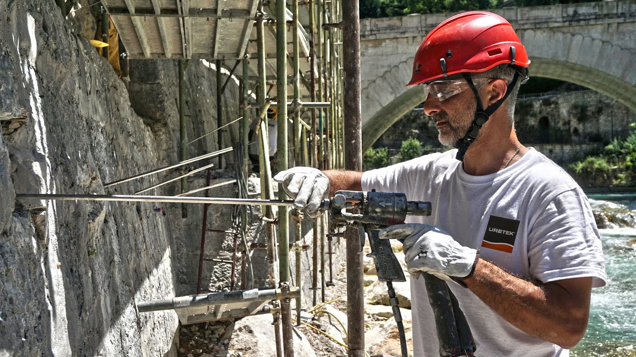 Stabilizzazione Manufatti Controterra con Tiranti di Ancoraggio su Muro Arginale a Rovereto - URETEK