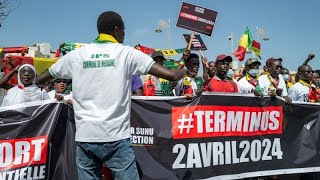 ⁣Senegalese citizens rally against presidential election postponement