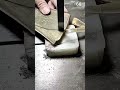 Cutting a precise groove in a wooden board using a chisel to shape and refine the joint