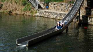 Barncow fully clothed on the slide at Windy Gap