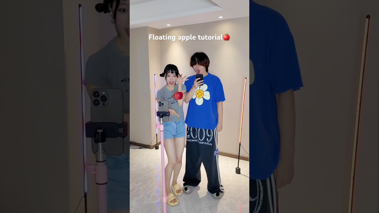 How is this apple floating? 🍎#magic #behindthescenes #couple #funny #dance #zoey