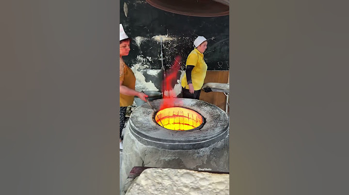 Baking Armenian traditional lavash bread in a hot fire 🔥