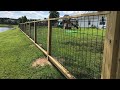 Diy hogwire panel fence using dado groove on a sloped yard