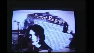 NIN band members watch an MTV news segment. 1994