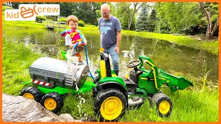 Watering crops and fertilizing with kids tractor on the farm. Educational how pumps work | Kid Crew